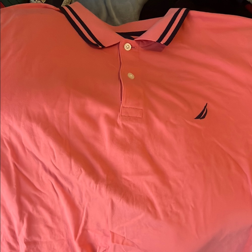 Pink activewear polo with navy blue design finish